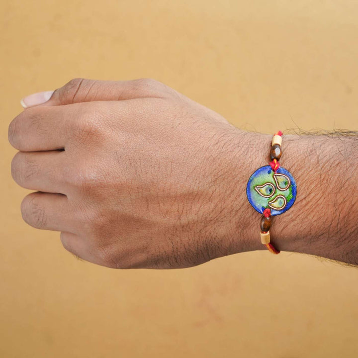 Handmade Morpankh Copper Enamel Rakhi With Chocolates & Roli Chawal