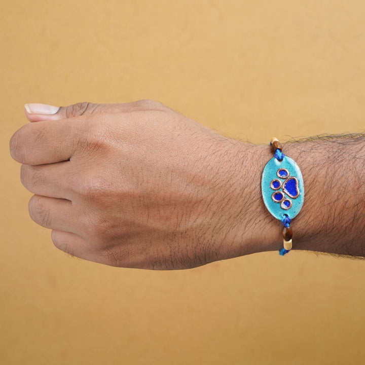 Handmade Pawfect Copper Enamel Rakhi With Chocolates & Roli Chawal
