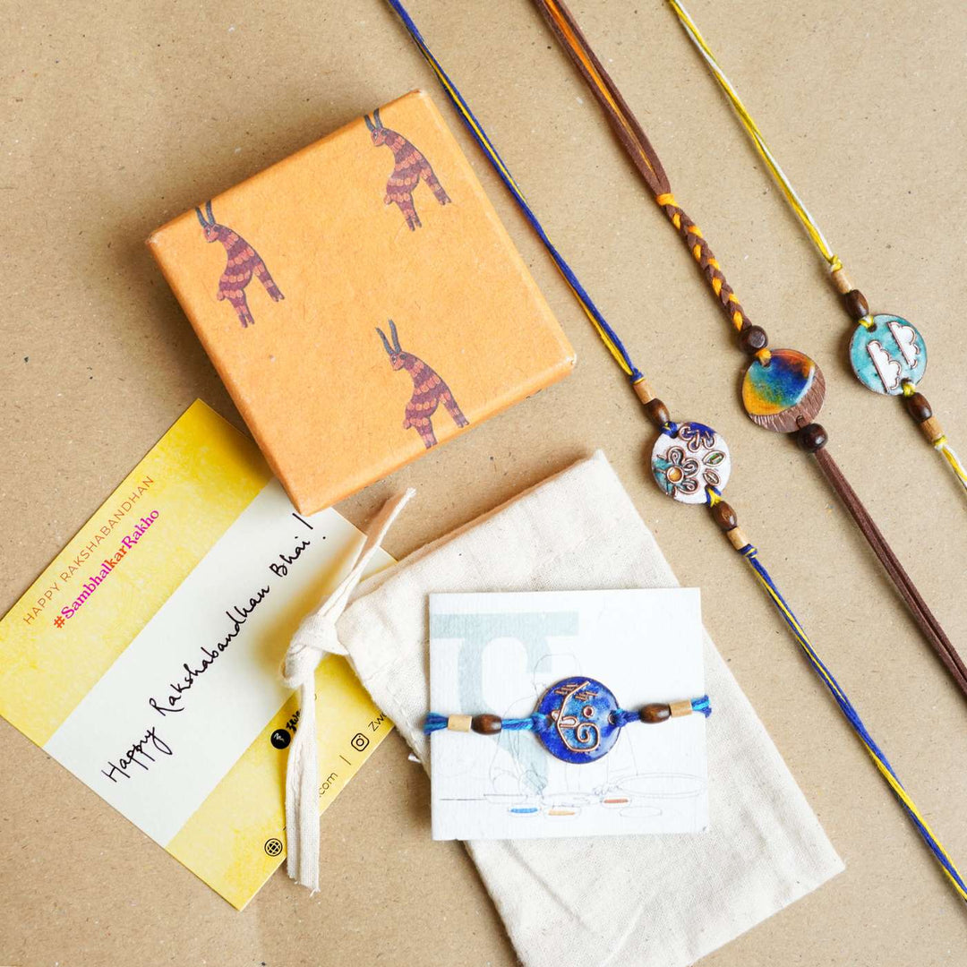 Handmade Pawfect Copper Enamel Rakhi With Chocolates & Roli Chawal