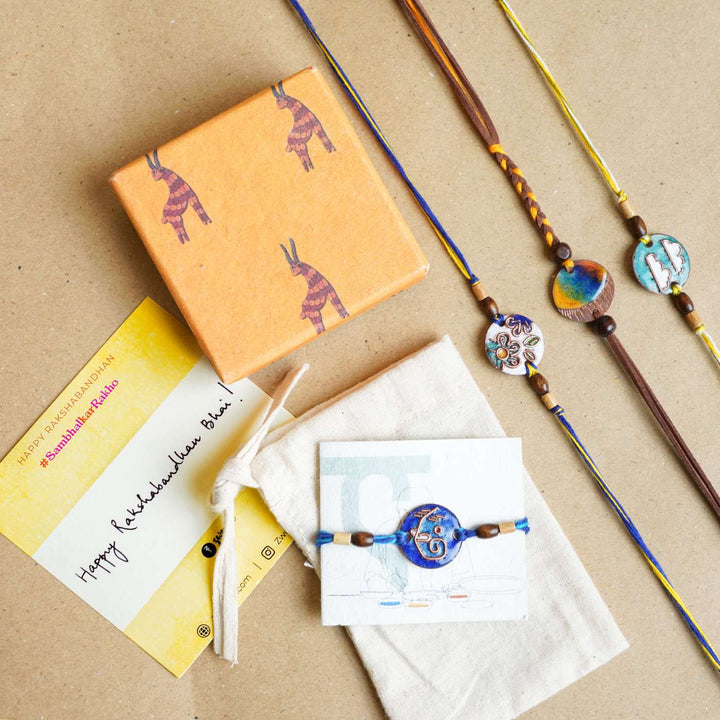 Handmade Pawfect Copper Enamel Rakhi With Chocolates & Roli Chawal