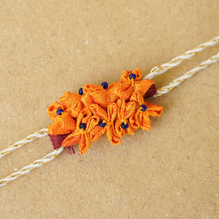 Handmade Yellow Cluster Flower Upcycled Fabric Rakhi With Roli Chawal