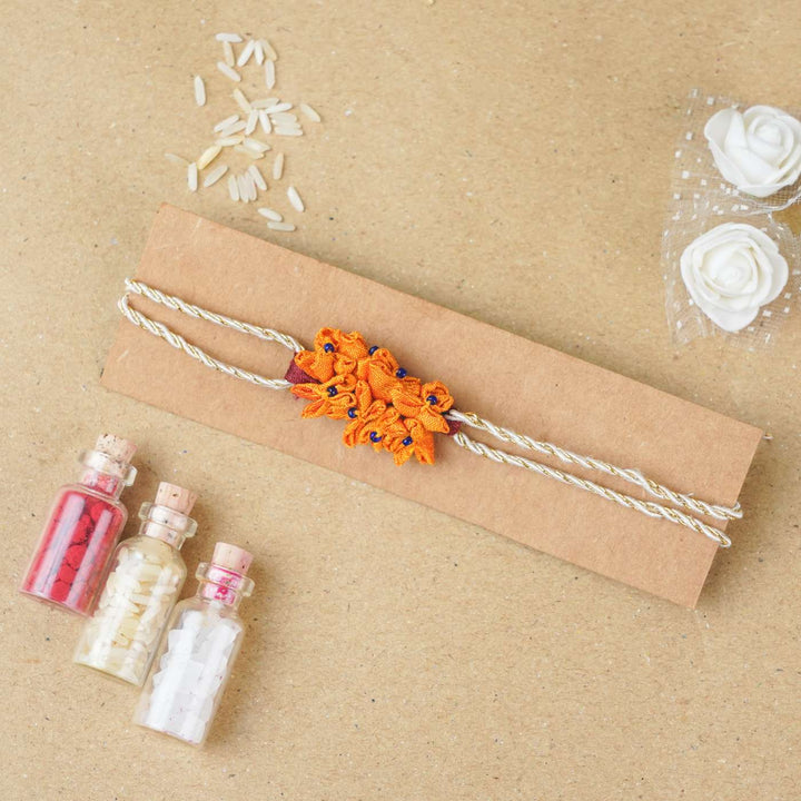 Handmade Yellow Cluster Flower Upcycled Fabric Rakhi With Roli Chawal