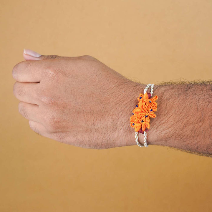 Handmade Yellow Cluster Flower Upcycled Fabric Rakhi With Roli Chawal