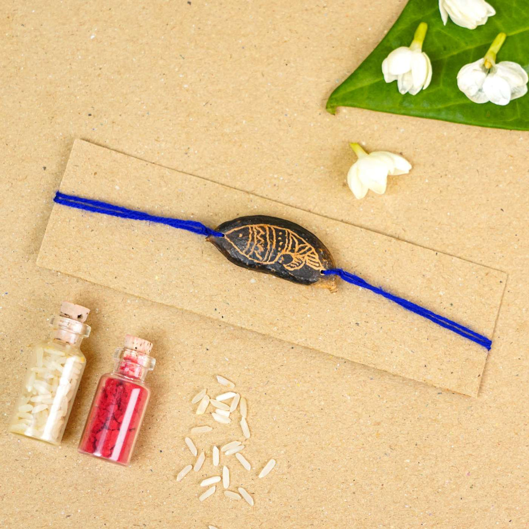 Handmade Plantable Blue Fish Seed Rakhi With Roli Chawal