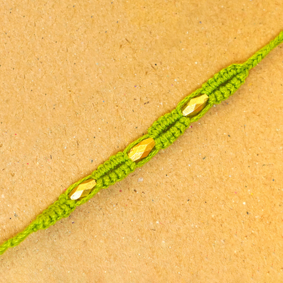 Handmade Macrame Three Gold Beaded Rakhi With Roli Chawal - Close-up Detail (7)