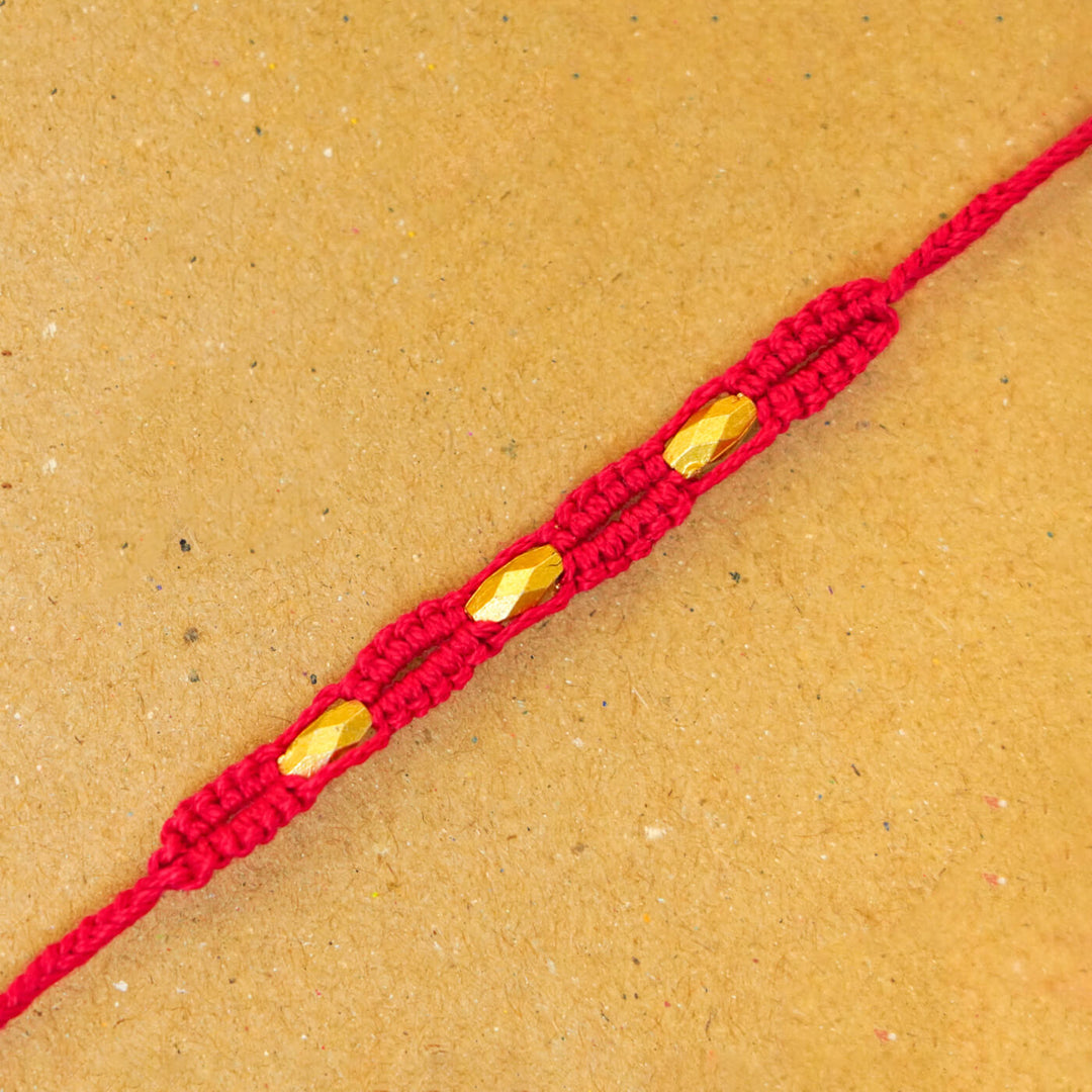 Handmade Macrame Three Gold Beaded Rakhi With Roli Chawal - Close-up Detail