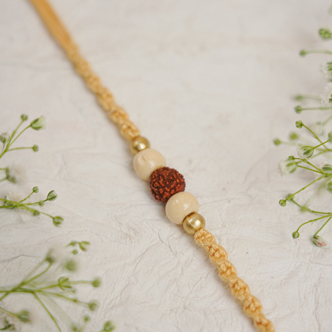 Handmade Pearl Rudraksha Rakhi With Roli Chawal - Detailed Bead Close-up