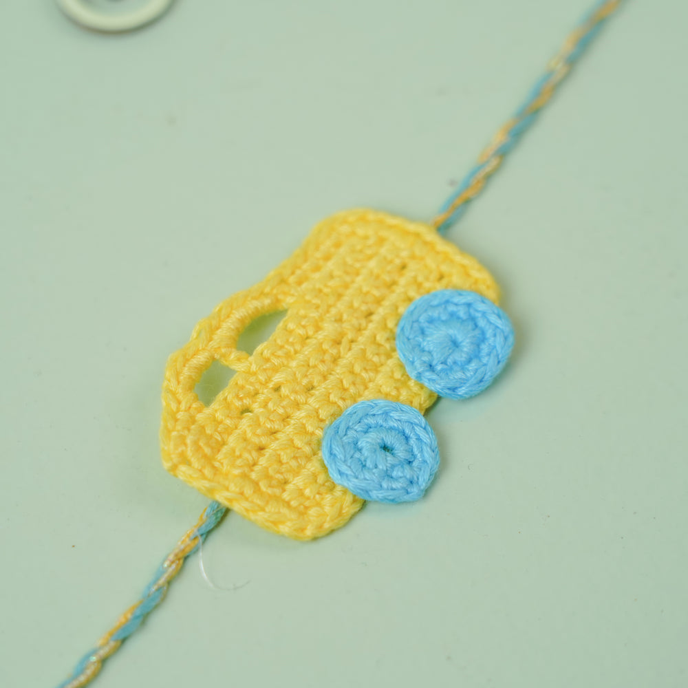 Handmade Crochet Bus Design Kids Rakhi With Roli Chawal - Close-up View of Crochet Detail