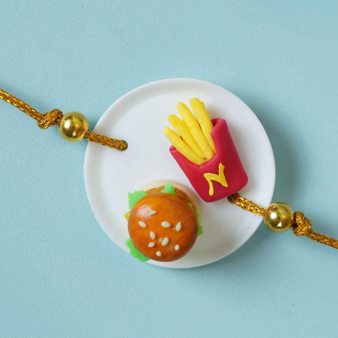 Handmade Miniature Clay Burger And Fries Rakhi With Roli Chawal - Close-up of Burger and Fries Rakhi