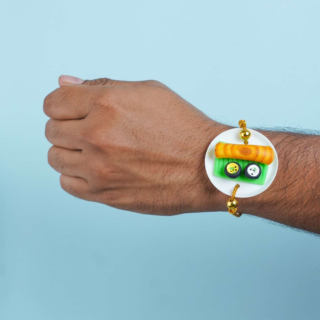 Handmade Miniature Clay Dosa Rakhi With Roli Chawal - On Wrist Model Display