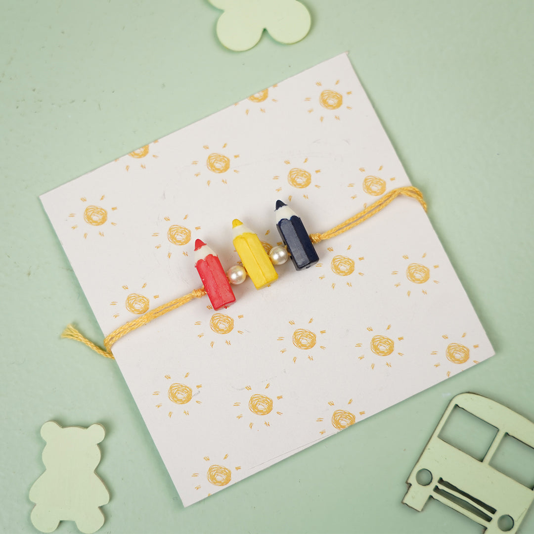 Handmade Pencil Andpearl Design Kids Rakhi With Roli Chawal - On Wrapped Card With Toys