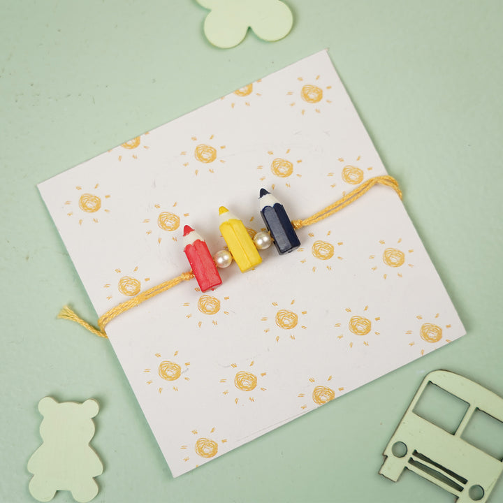Handmade Pencil Andpearl Design Kids Rakhi With Roli Chawal - On Wrapped Card With Toys