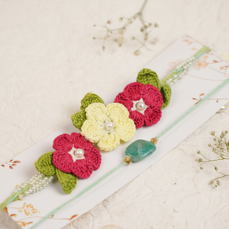 Handmade Reusable Red Floral Bliss Pearl Bhaiya Bhabhi Rakhi With Roli Chawal - Close-up of floral bracelet detail