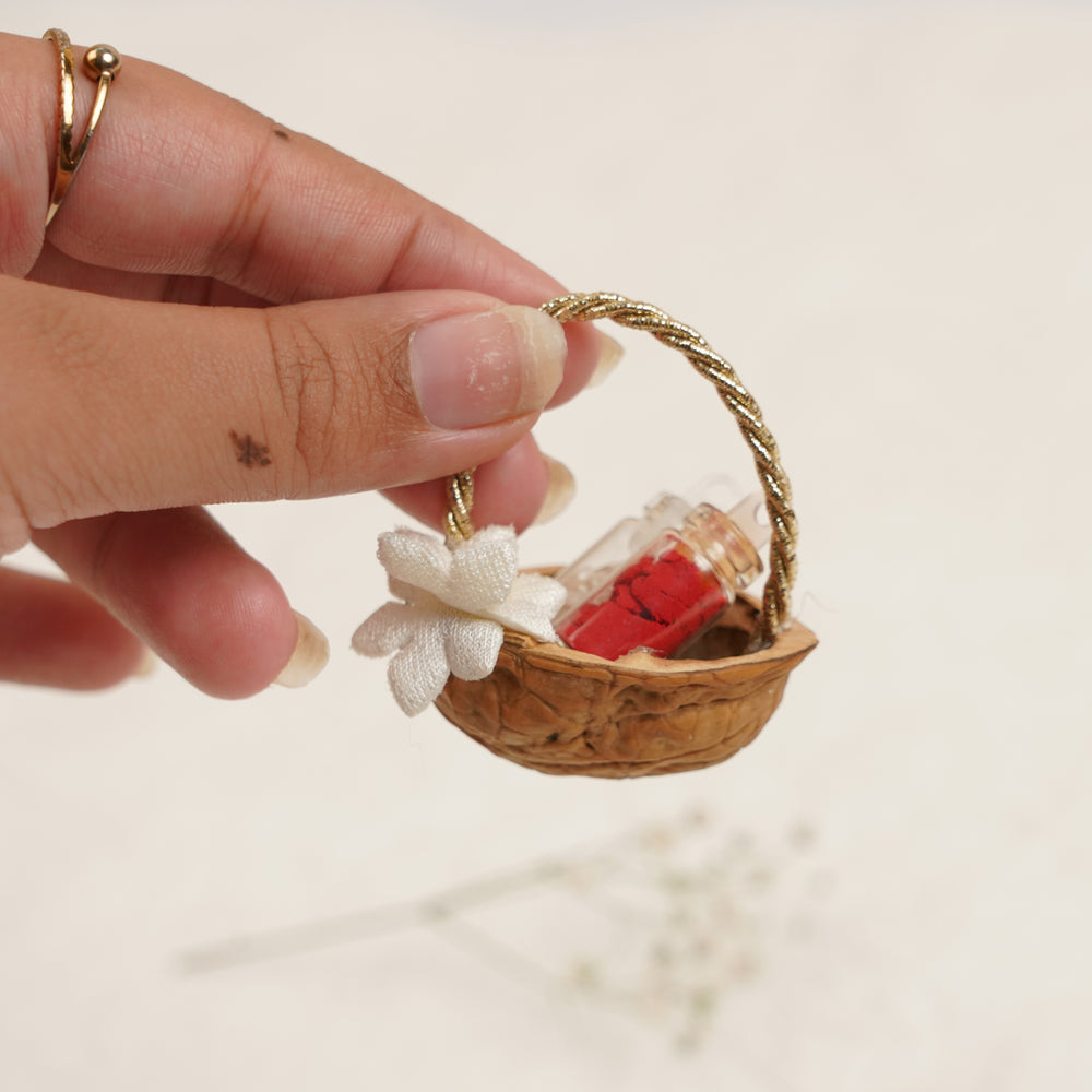 Handmade Decorative Akhrot Roli Chawal - Size Comparison with Hand