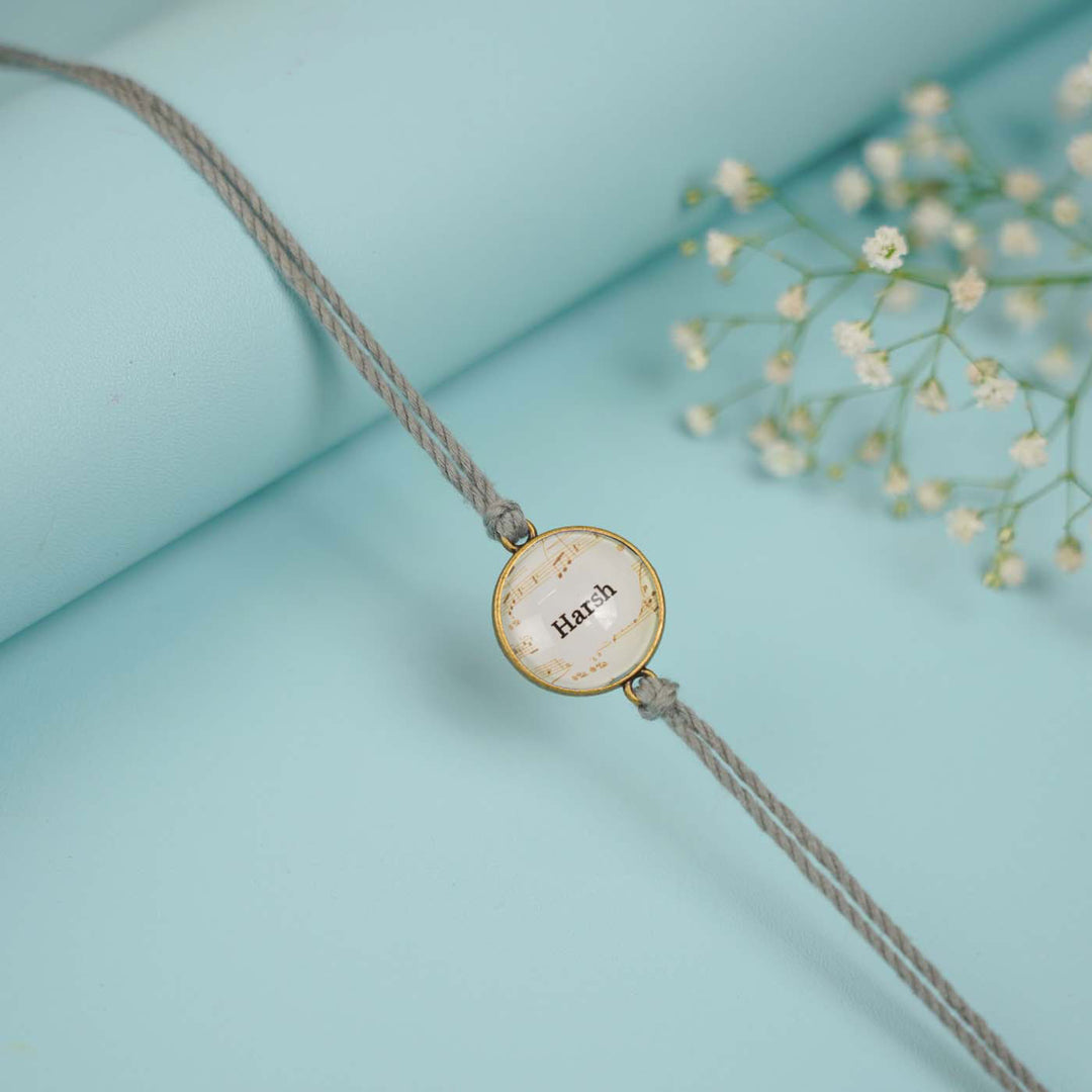 Photo Personalized Handmade Round Antique Bronze Rakhi With Roli Chawal Copy - Close-up of Bracelet Detail