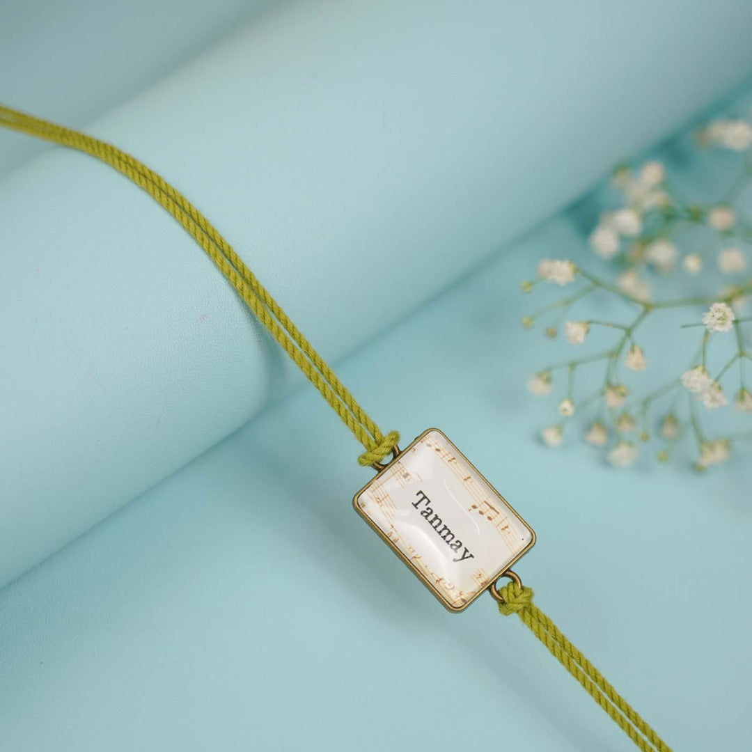 Photo Personalized Handmade Rectangle Antique Bronze Rakhi With Roli Chawal Copy - Detailed View of Name Tag