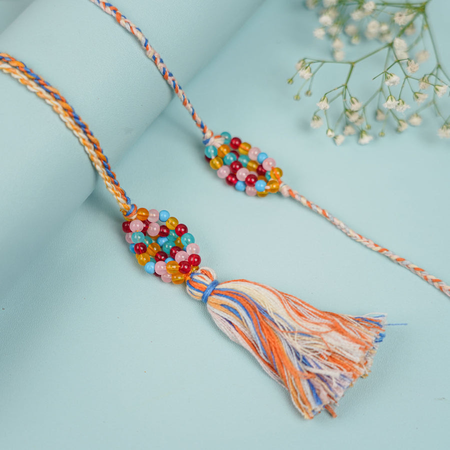 Handmade Beaded Rang Bhaiya Bhabhi Rakhi With Roli Chawal Set Of 2 - Close-up Showing Beaded Tassel
