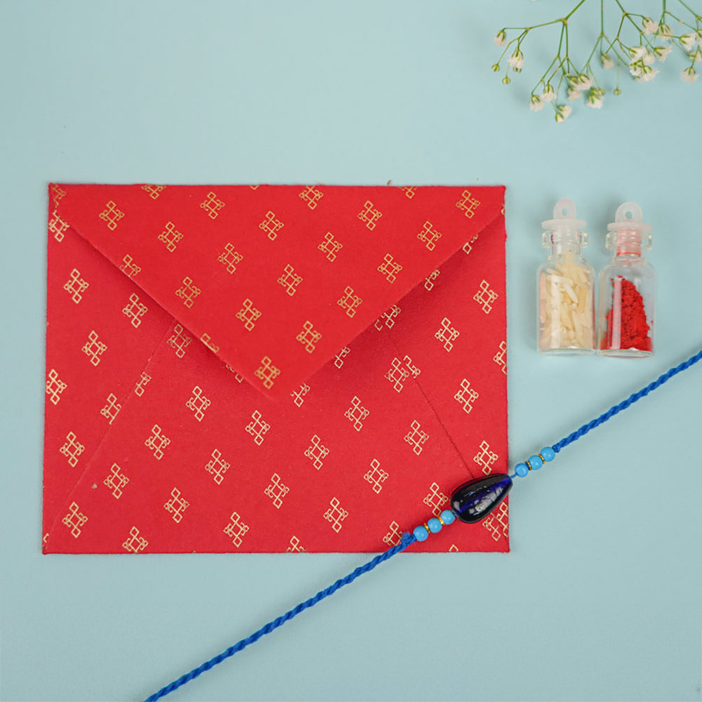 Handmade Beaded Neel Dhruv Rakhi With Roli Chawal - Included Envelope and Accessories Arrangement