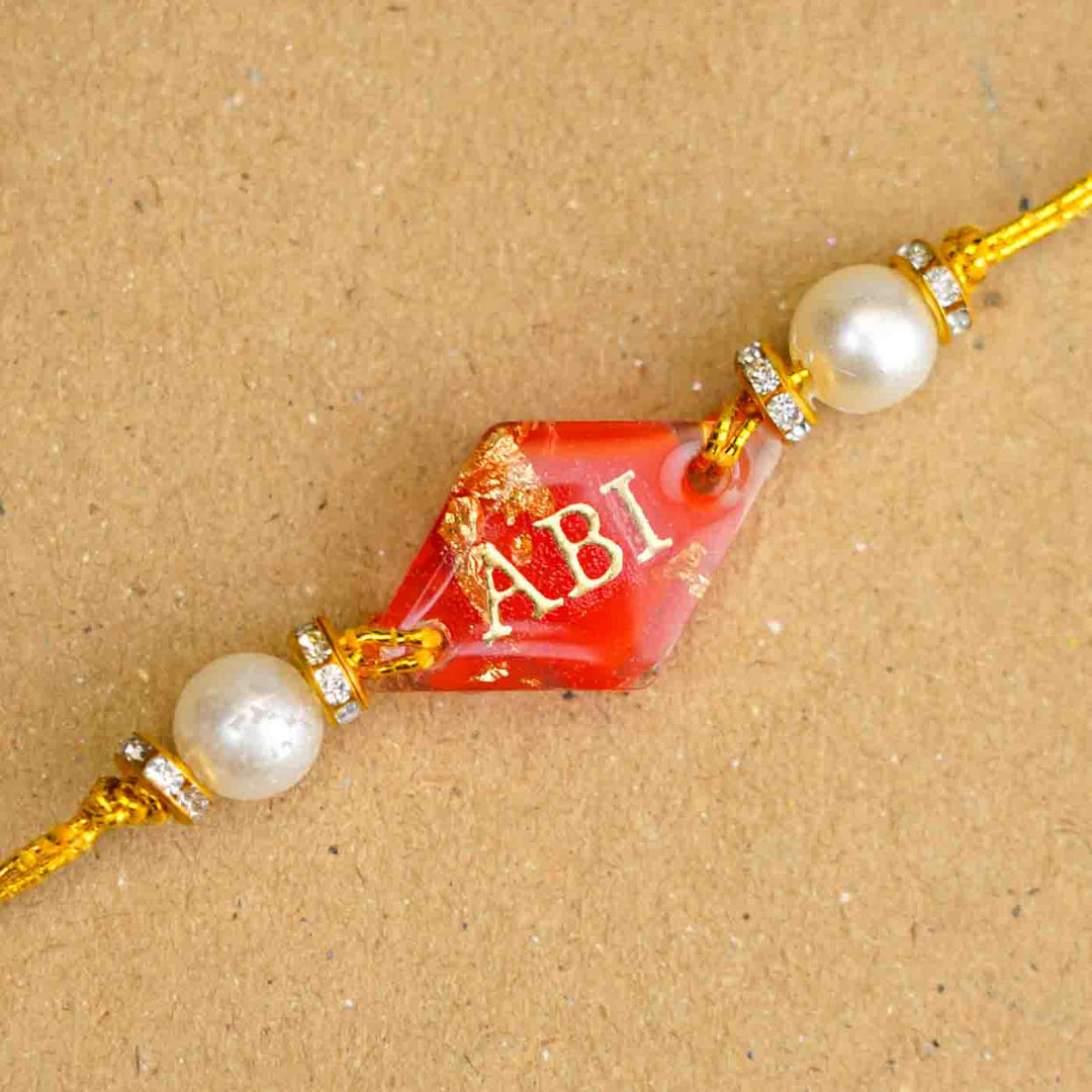 Personalized Handmade Red Resin Rakhi With Roli Chawal