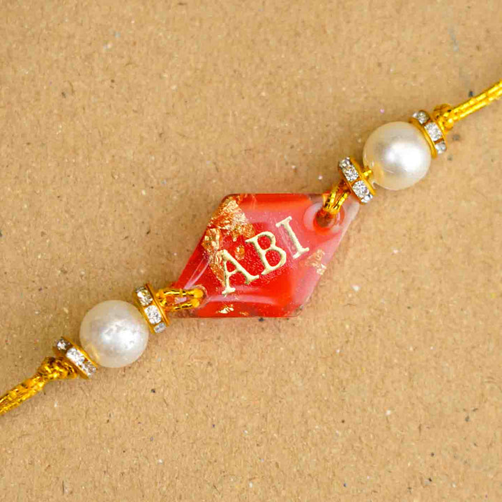 Personalized Handmade Red Resin Rakhi With Roli Chawal
