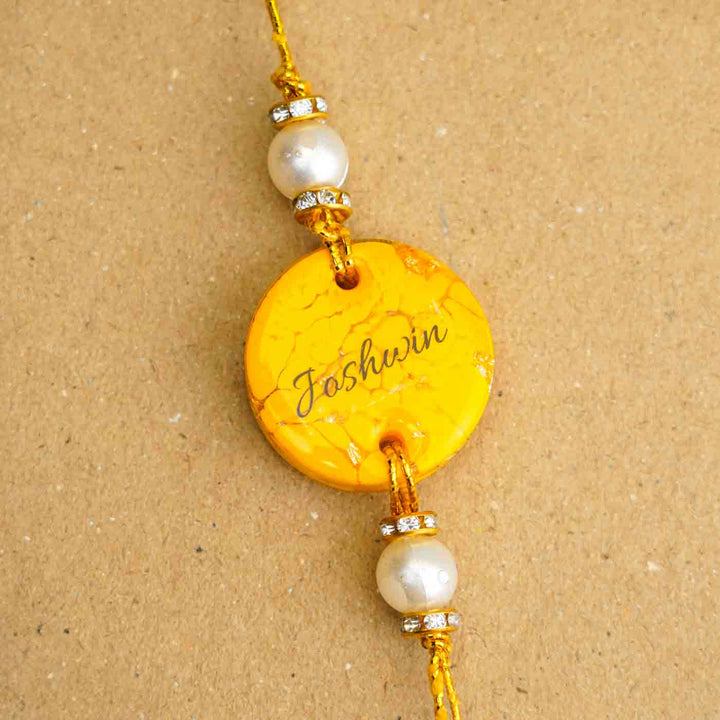 Personalized Handmade Yellow Resin Rakhi With Roli Chawal