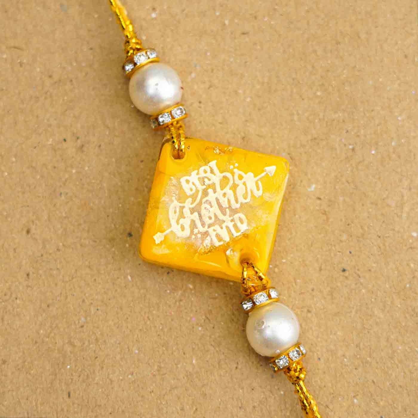 Buy Personalized Handmade Yellow Resin Rakhi With Roli Chawal Online On ...