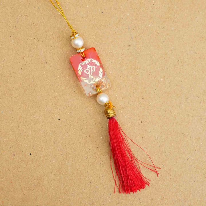 Personalized Handmade Red Resin Lumba Rakhi For Bhabhi With Roli Chawal - Close-up of Rakhi Thread