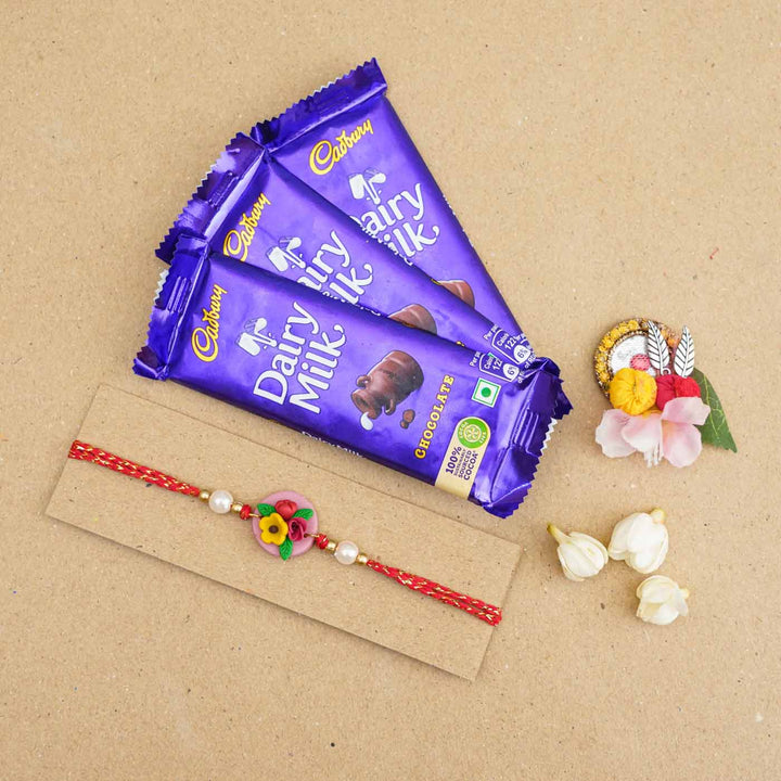 Handmade Miniature Clay Yellow and Red Floral Rakhi With Roli Chawal