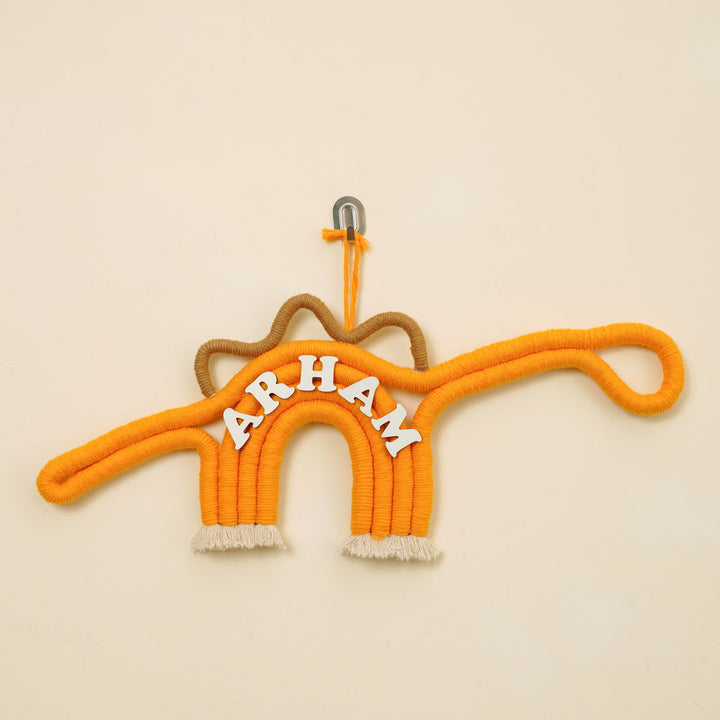 Personalized Handmade Macrame Dinosaur Kids Name Plate With 3D Letters - Front View Hanging on Hook