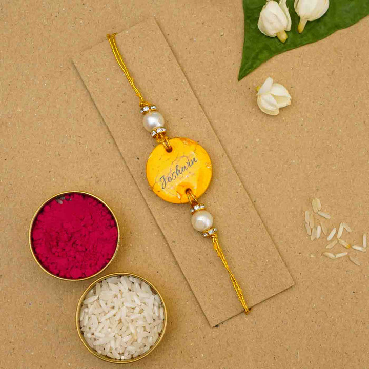 Personalized Handmade Yellow Resin Rakhi With Roli Chawal