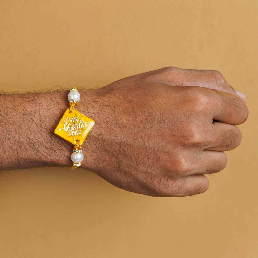 Personalized Handmade Yellow Resin Rakhi With Roli Chawal
