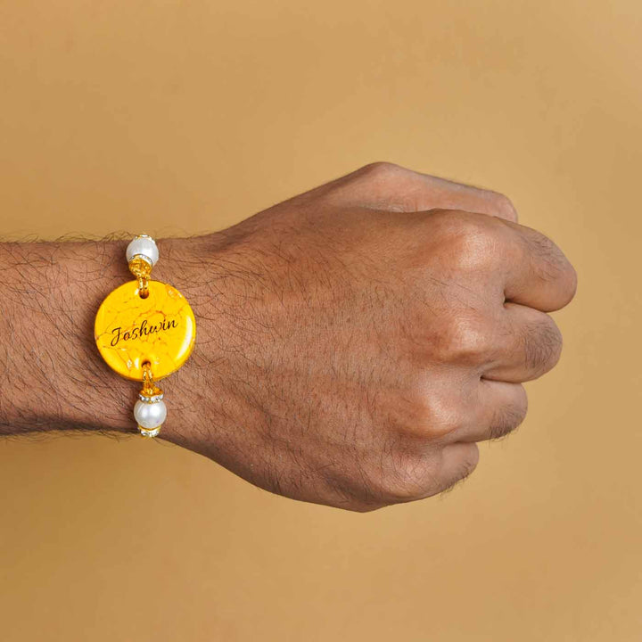 Personalized Handmade Yellow Resin Rakhi With Roli Chawal