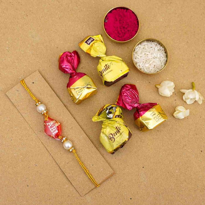 Personalized Handmade Red Resin Rakhi With Roli Chawal