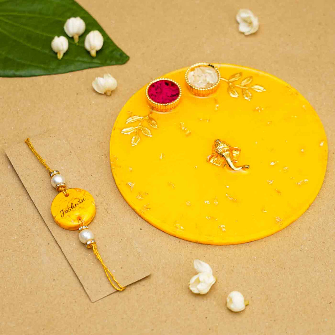 Personalized Handmade Yello Resin Rakhi Thali With Roli Chawal For Brother Set Of 2 - Personalized Rakhi with plate display