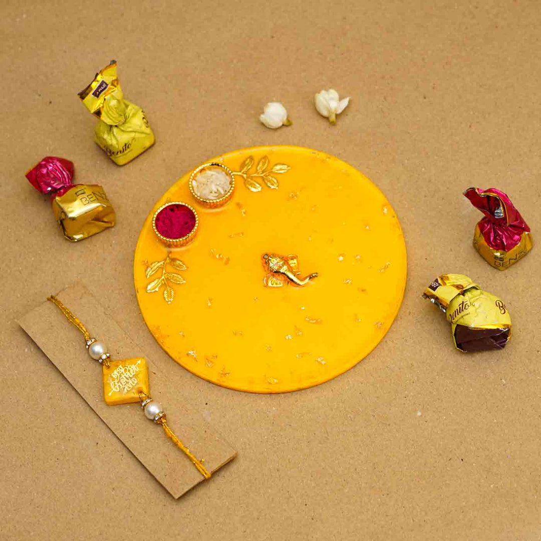 Personalized Handmade Yello Resin Rakhi Thali With Roli Chawal For Brother Set Of 2 - Rakhi with chocolates arrangement