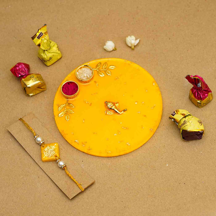 Personalized Handmade Yello Resin Rakhi Thali With Roli Chawal For Brother Set Of 2 - Rakhi with chocolates arrangement
