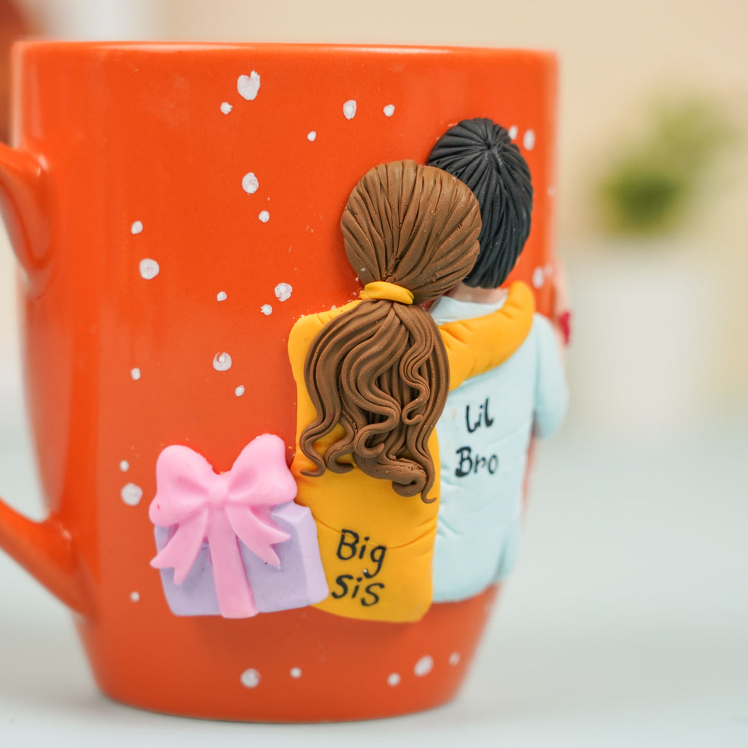 Handmade Big Sis And Lil Bro Clay Rakhi Hamper With Roli Chawal Includes 1 Mug 1 Rakhi - Mug Engraving Close-up Side View