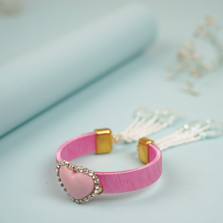 Handmade Heart Shaped Clay Bhaiya Bhabhi Rakhi With Roli Chawal Set Of 2 - Close-up of Pink Heart Bracelet