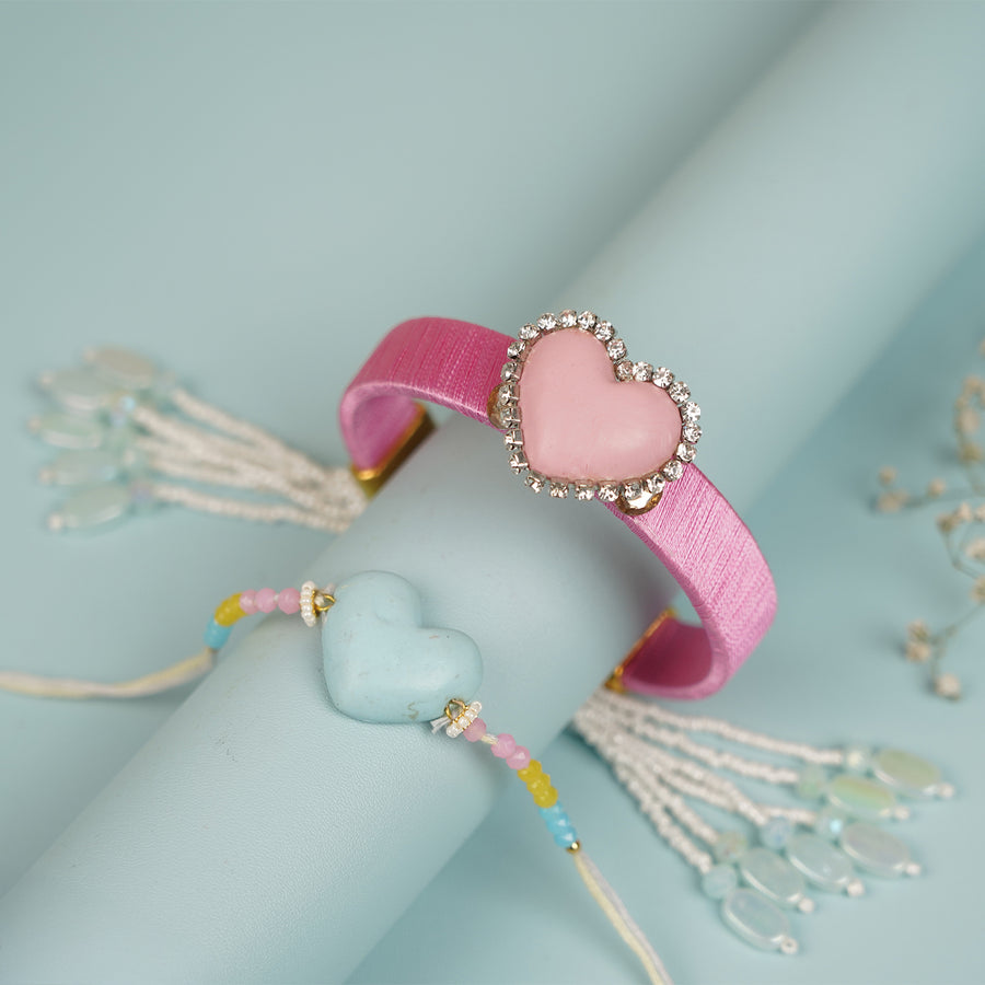 Handmade Heart Shaped Clay Bhaiya Bhabhi Rakhi With Roli Chawal Set Of 2 - Bracelets Displayed Together