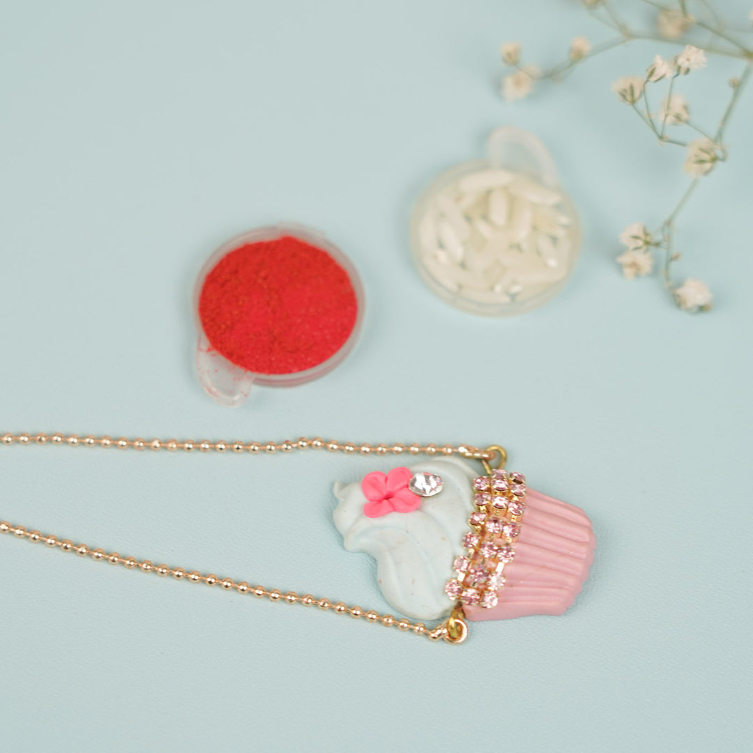 Handmade Cupcake Theme Clay Bracelet Rakhi With Roli Chawal For Sisters - Flat Lay with Accessories