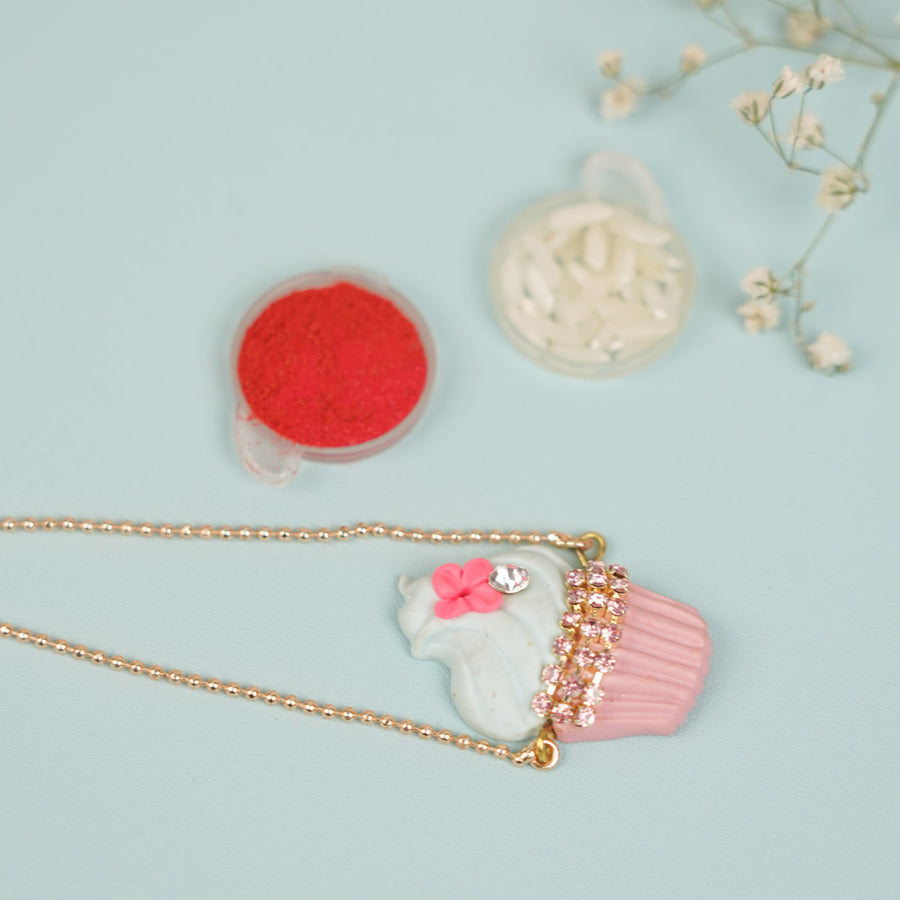 Handmade Cupcake Theme Clay Bracelet Rakhi With Roli Chawal For Sisters - Flat Lay with Accessories