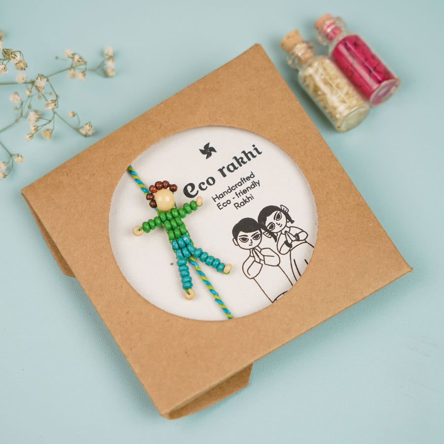 Handmade Beaded Blue Disco Boy Wooden Rakhi With Roli Chawal For Kids - In Packaging