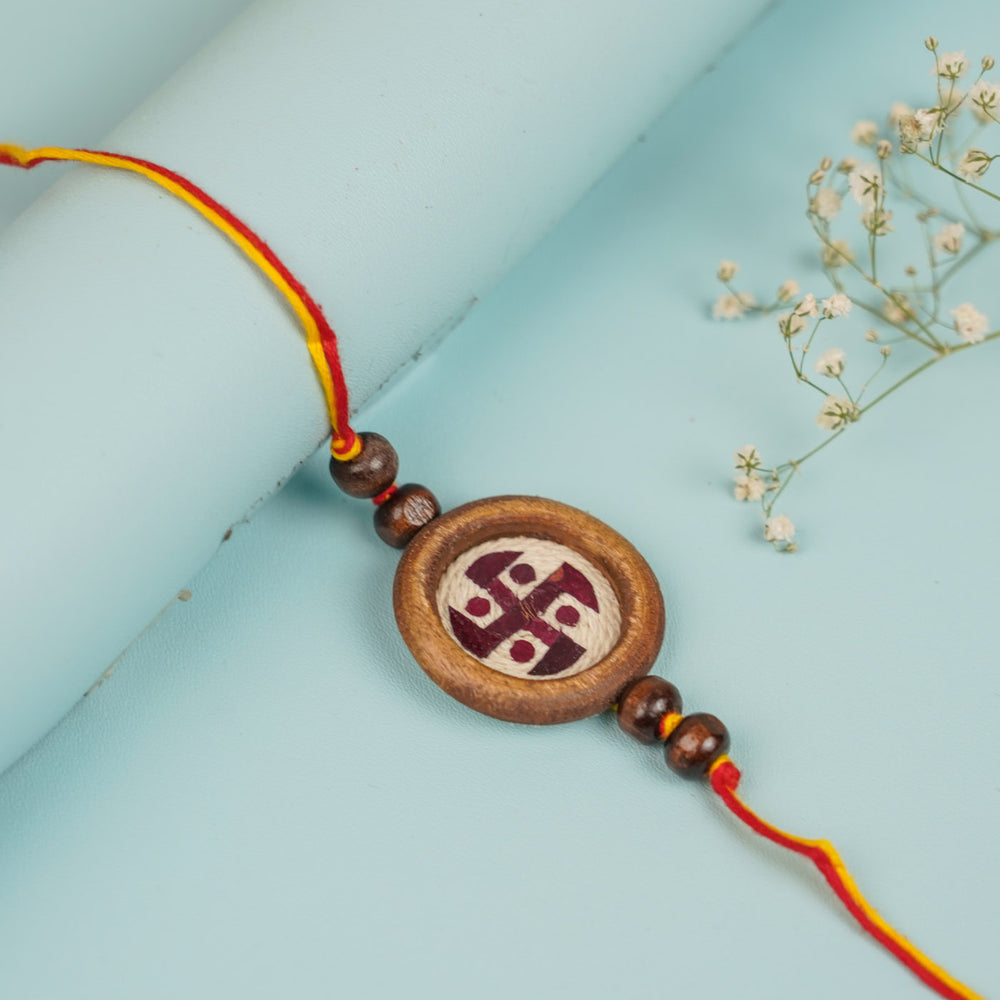 Handmade Pressed Flower Art Brown Beads Wooden Rakhi With Roli Chawal For Brother - Front View Lying Flat