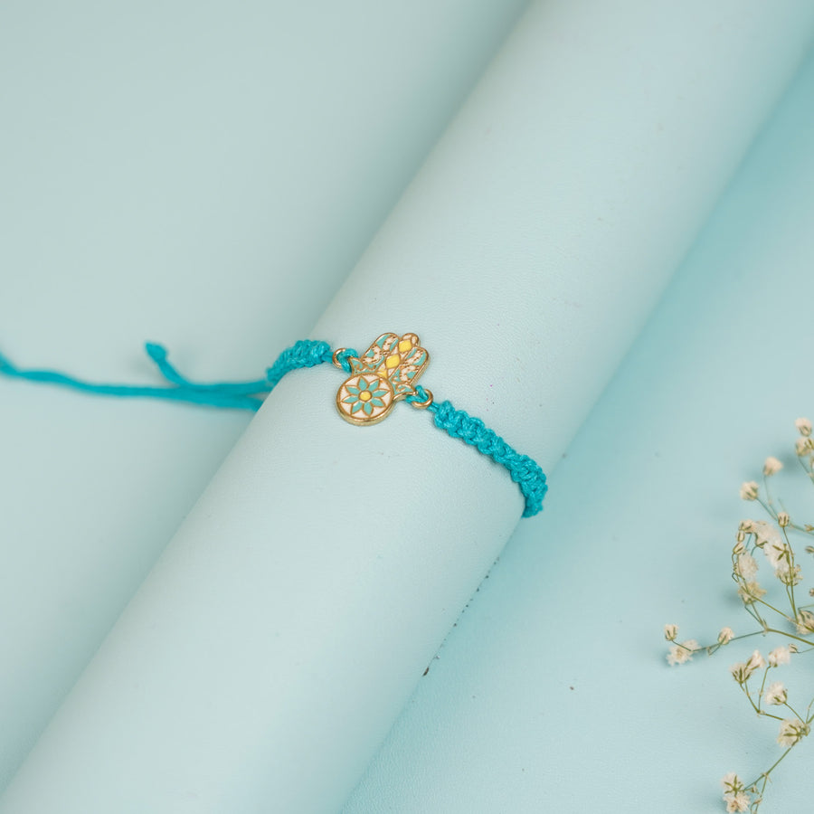 Handmade Hamsa Hand Design Metal Rakhi For Brother - Wrapped Around Cylinder Display