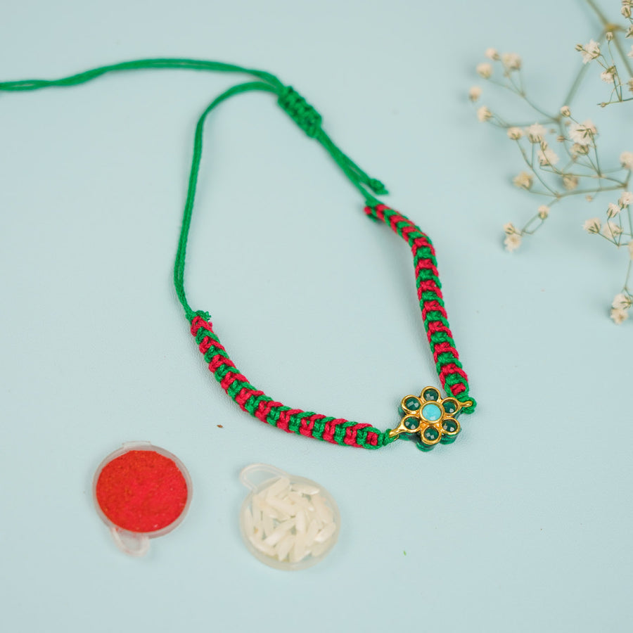 Handmade Floral Design Metal Rakhi For Brother - Flat Lay with Accessories