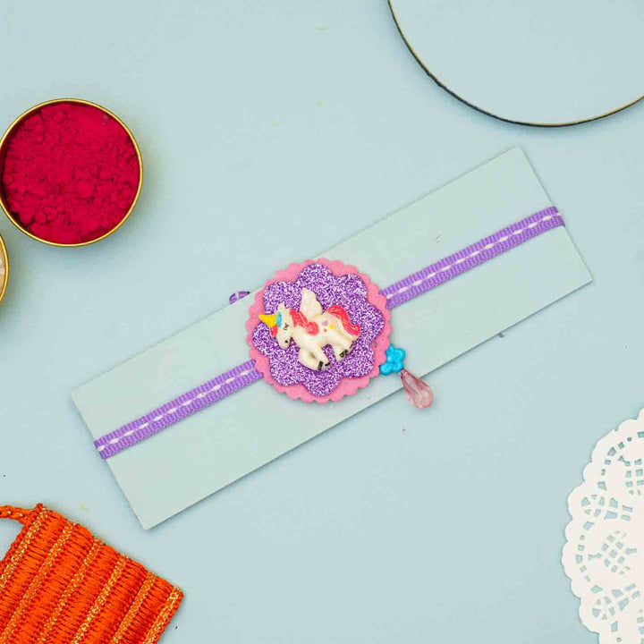 Handmade Unicorn Theme Felt Kids Rakhi With Roli Chawal For Sisters - Product Laid Flat with Packaging