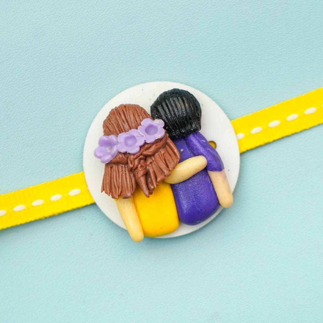 Reusable Miniature Clay X Large Rakhi With Roli Chawal - Close-up of Embossed Figurines