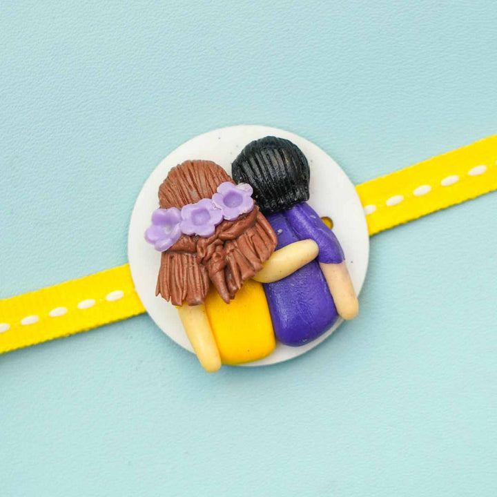 Reusable Miniature Clay X Large Rakhi With Roli Chawal - Close-up of Embossed Figurines