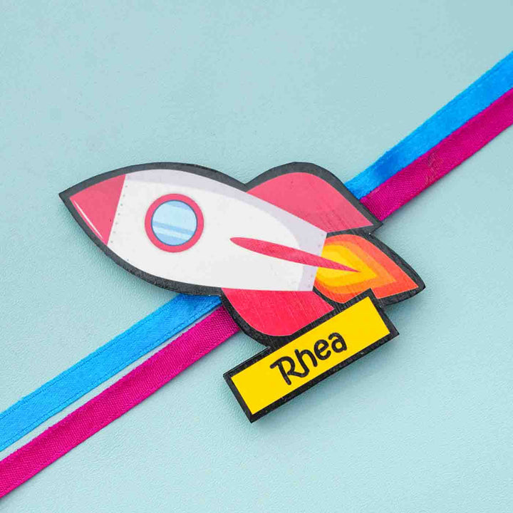 Personalized Reusable X Large Spaceship Mdf Wood Rakhi With Chocolates And Roli Chawal - Name Personalization Close-up