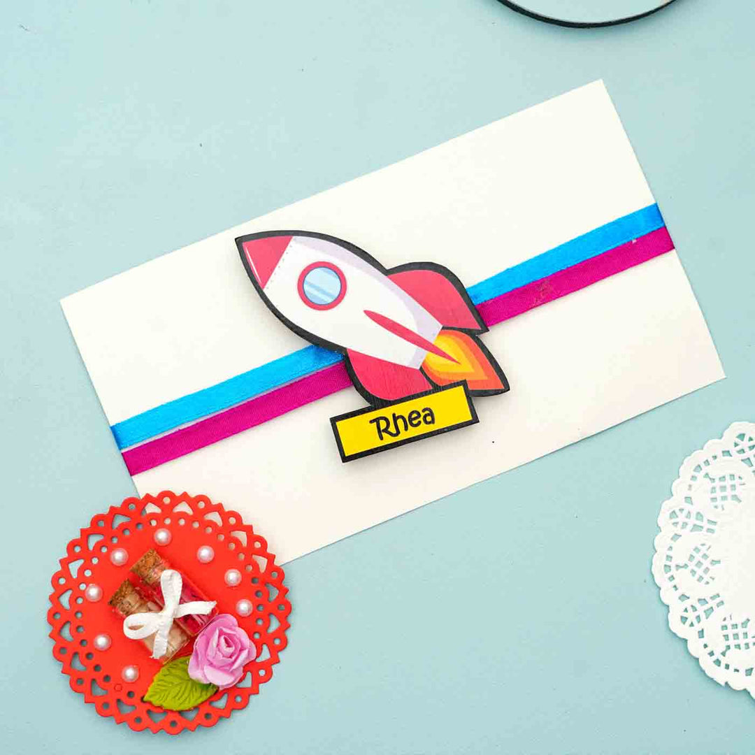 Personalized Reusable X Large Spaceship Mdf Wood Rakhi With Chocolates And Roli Chawal - Mounted on Greeting Card Example